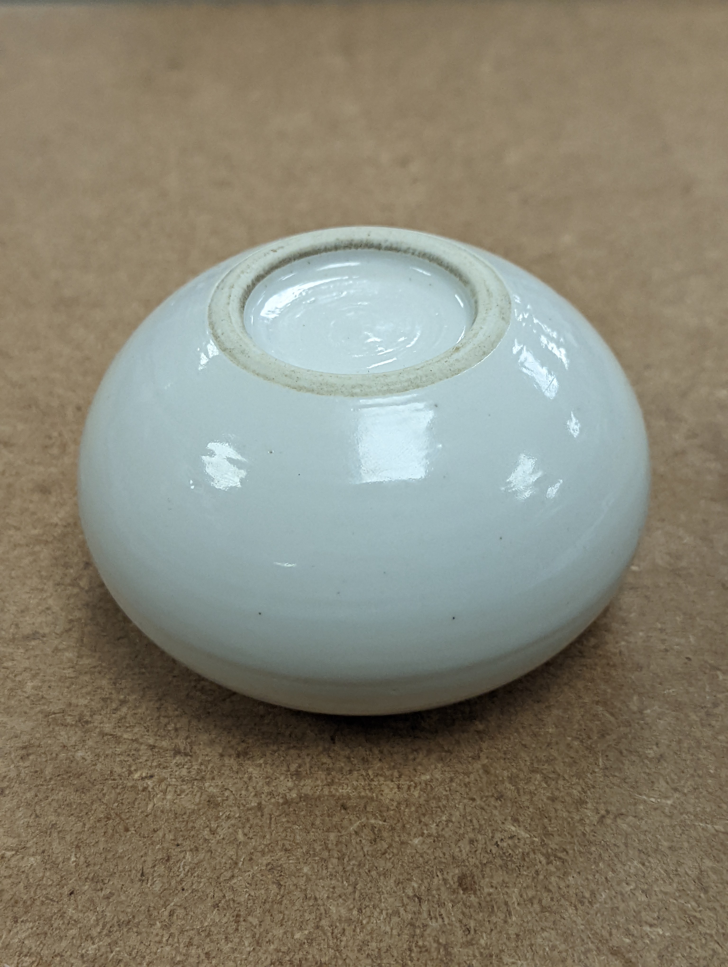 A Chinese white glazed water pot and a similar cup (2)
